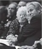  ??  ?? From left, Annie Glenn, widow of former senator and astronaut John Glenn, Glenn’s daughter Lyn, and Pock Otis hold hands during Saturday’s services for Glenn. Bill Ingalls, NASA
