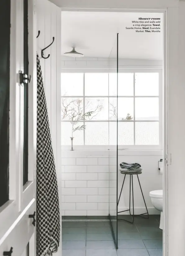  ??  ?? Shower room
White tiles and walls add a crisp elegance. Towel,
Saarde Home. Stool, Evandale Market. Tiles, Montile