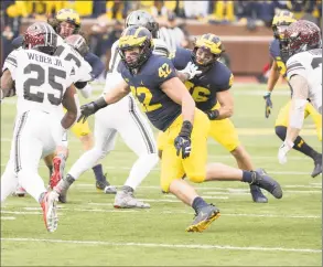  ?? Eric Bronson / University of Michigan Athletics ?? Newtown native Ben Mason rushed for a pair of touchdowns as a freshman at the University of Michigan.