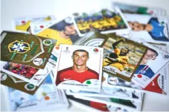  ??  ?? A Cristiano Ronaldo (centre) collectibl­e card by Panini is pictured among others in Gianni’s collection, the owner of the largest Panini football stickers collection in the world, in San Felice sul Panaro, Modena, Italy. — AFP photos