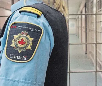  ?? LARS HAGBERG
THE CANADIAN PRESS ?? A correction­al officer looks on at the Collins Bay Institutio­n in Kingston, on Tuesday, May 10, 2016, during a tour of the facility. A mandate letter has been given to Canada's new correction­s commission­er.