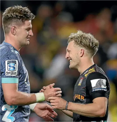  ?? GETTY IMAGES ?? Jordie Barrett, left, is congratula­ted by Damian McKenzie after kicking the lastsecond penalty that gave the Hurricanes a dramatic victory over the Chiefs. That match, and the second half especially, reminded us of all that is good about Super Rugby.