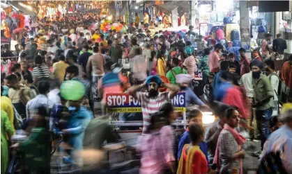  ?? Photograph: Shammi Mehra/AFP/Getty Images ?? The cartoon was published as India’s population surpasses China for the first time, according to United Nations projection­s.