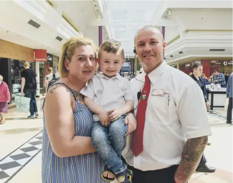  ??  ?? Three-year- old Jayden Percy and and mum Sarah Grey thank Bridges security guard Carl Simpson