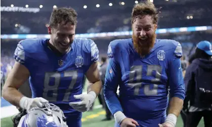  ?? ?? Sam LaPorta and Jake McQuaide celebrate after the Lions’ defeat of the Rams. Photograph: Rey Del Rio/Getty Images