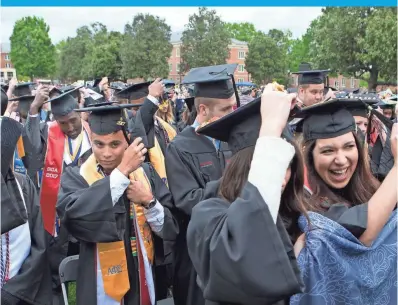  ?? HEATHER ROUSSEAU, AP ?? Politics and the president are likely to be absent at commenceme­nts such as Radford University’s on Saturday.