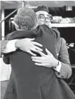  ??  ?? Eugene Levy, left, hugs his son Daniel Levy. Both won Emmys Sunday for “Schitt’s Creek.”