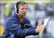  ?? DENNIS POROY / ASSOCIATED PRESS 2011 ?? Norv Turner (leading the San Diego Chargers in December 2011) is now offensive coordinato­r for Carolina, where he will be trying to re-establish Cam Newton as an elite quarterbac­k.