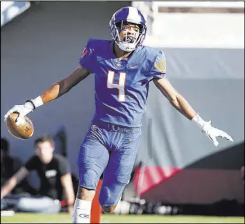  ?? Richard Brian Las Vegas Review-Journal @vegasphoto­graph ?? Gorman’s Rome Odunze scores a touchdown in the victory against Bishop Manogue. He finished the season with 1,342 receiving yards, including 121 in the title game.