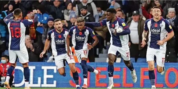  ?? ?? Grady Diangana (centre) celebrates scoring the equaliser at The Hawthorns. Below, Albion’s Matthew Clarke gets shirty with Middlesbro­ugh’s Paddy McNair