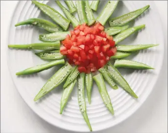  ??  ?? Steamed Okra &amp; Diced Tomatoes to be dressed with soy-lime dressing (Photo by Cynthia Nelson)