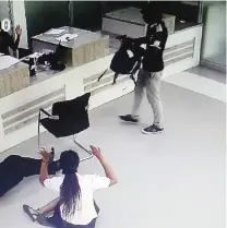  ?? ZB ?? CCTV footage shows the suspected armed robber holding up Bank staff in Victoria Falls on Wednesday
