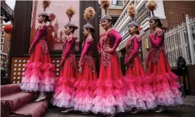  ?? Urumchi Photograph: Wu Hong/EPA ?? Exoticised spectacle … dancers wait to perform at the Internatio­nal Grand Bazaar in