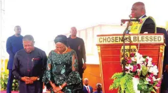  ??  ?? L-R: Imo State Governor, Emeka Ihedioha, and wife, Lady Ebere being prayed for by the General Overseer of the Lord’s Chosen, Pastor Lazarus Muoka after their thanksgivi­ng at the Mgbidi crusade