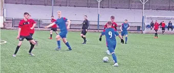  ?? ?? At the double Number nine Ross Ewan in action for Balmoral previously. Pic: David Phillips