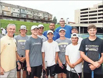  ?? / Kevin Myrick ?? Nick Kyrgios and John Isner stopped for a photo with the Rockmart Boys Tennis Team during their visit to the BB&amp;T Open. They also got to play with Kyrgios as well.