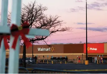  ?? — AFP photo ?? Photo shows a parking lot near the site of a shooting at the Chesapeake Walmart Supercentr­e in Chesapeake, Virginia.