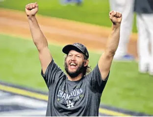  ?? USA TODAY SPORTS ?? Los Angeles Dodgers starting pitcher Clayton Kershaw celebrates after the Los Angeles Dodgers beat the Tampa Bay Rays to win the World Series on Oct. 27.