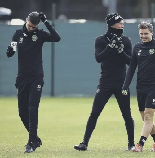  ??  ?? 0 James Forrest, third from left, shares a joke with team-mates during training at Lennoxtown yesterday. Left, Celtic boss Brendan Rodgers, who describes Forrest as a ‘brilliant player’.