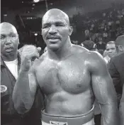  ?? MARK J. TERRILL Associated Press file, 1996 ?? Evander Holyfield is 57 now, and still at his fighting weight of 215 pounds, and might have one more bout with ring nemesis Mike Tyson, who he’s fought twice already.