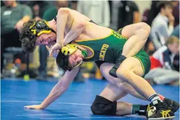  ??  ?? Kellam’s Guy Hall takes control against Great Bridge’s Jesse Alvarado at 145 pounds. Alvarado went on to win the weight class while Hall finished third.