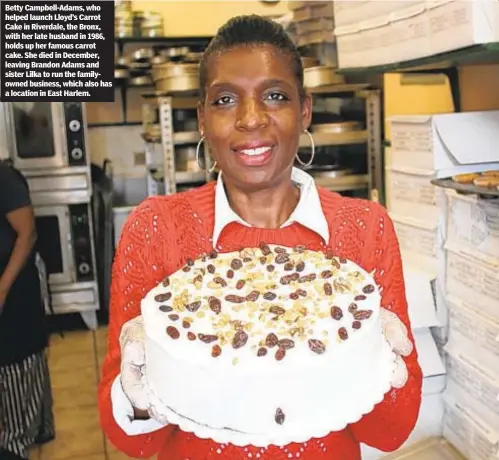  ??  ?? Betty Campbell-Adams, who helped launch Lloyd’s Carrot Cake in Riverdale, the Bronx, with her late husband in 1986, holds up her famous carrot cake. She died in December, leaving Brandon Adams and sister Lilka to run the familyowne­d business, which also has a location in East Harlem.