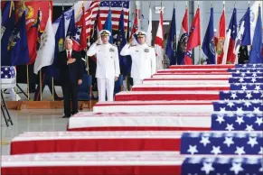  ?? ASSOCIATED PRESS ?? VICE PRESIDENT MIKE PENCE (LEFT), COMMANDER of U.S. Indo-Pacific Command Adm. Phil Davidson (center) and Rear Adm. Jon Kreitz, deputy director of the POW/MIA Accounting Agency, attend a ceremony marking the arrival of the remains believed to be of...