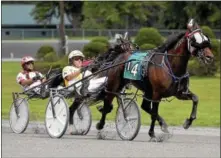  ?? FILE PHOTO ?? Best Shot N (4), with driver Phil Fluet, wins Race 1 over runner-up Hal N Sammy, with driver Jim Devaux on Sept. 14, 2017 at Saratoga Casino Hotel.