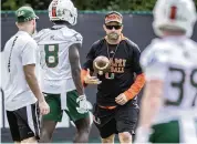  ?? AL DIAZ adiaz@miamiheral­d.com ?? Coach Manny Diaz had only four on-field sessions with his Hurricanes players before spring practice was halted by the pandemic.