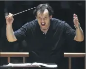  ?? STEVEN SENNE — AP PHOTO ?? Boston Symphony Orchestra music director Andris Nelsons rehearses with the orchestra at Symphony Hall, in Boston, Nov. 20, 2014.