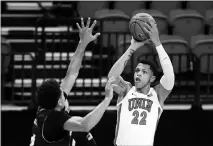  ?? STEVE MARCUS ?? UNLV freshman guard Nick Blake (22) puts up a shot Wednesday against Fresno State at the Thomas & Mack Center. Blake and Devin Tillis are the lone freshmen seeing significan­t playing time for the Rebels this season.