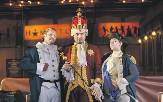  ?? Photograph­s by Jay L. Clendenin Los Angeles Times ?? FANS in costume outside the theater: Miguel Godinez as Alexander Hamilton, left, Chad Evett as King George III and Katie Aiani as George Washington.