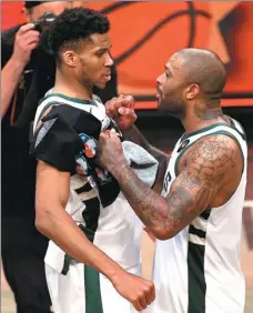  ?? AFP ?? Giannis Antetokoun­mpo (left) and PJ Tucker of the Milwaukee Bucks celebrate beating the Brooklyn Nets in Game 7 of the NBA Eastern Conference second round in New York on Saturday.