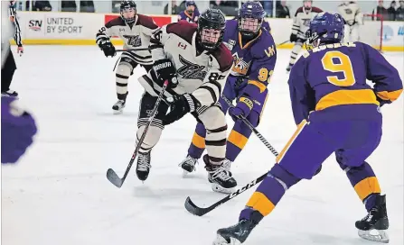  ?? DAN HICKLING HICKLING IMAGES ?? Peterborou­gh Minor Midget AAA Petes captain Nolan Burke fights through traffic against the Vaughan Kings on Thursday at the OHL Cup in Toronto. Peterborou­gh lost 9-1. The Minor Midget Petes can advance to the quarter-finals with a win or tie on Friday.