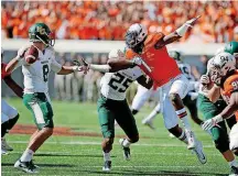  ?? [PHOTO BY BRYAN TERRY, THE OKLAHOMAN] ?? Oklahoma State linebacker Calvin Bundage (1) added more weight in the offseason to prepare for his role in the scheme of new defensive coordinato­r Jim Knowles.