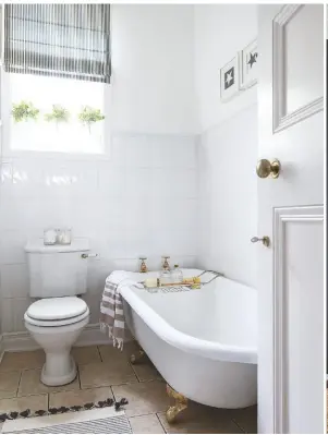  ??  ?? BATHROOM A traditiona­l-style bath is in keeping with the era of the house.
Essex cast iron roll-top bath, £1,520; Bristan traditiona­l pillar bath taps in gold, £141, both Victorian Plumbing