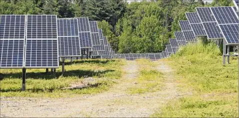  ?? Hans Pennink / Associated Press ?? Solar farms like Sugar Hill Solar Site in Clifton Park struggle to deliver that power south to the massive New York City market.