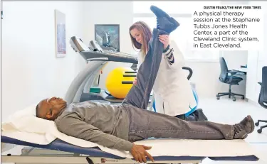  ?? DUSTIN FRANZ/THE NEW YORK TIMES ?? A physical therapy session at the Stephanie Tubbs Jones Health Center, a part of the Cleveland Clinic system, in East Cleveland.