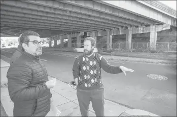  ?? JONATHAN OLSON/SPECIAL TO THE COURANT ?? Anthony Cherolis, right, Transporta­tion Hartford coordinato­r at the Center for Latino Progress in Hartford, talks with Carlos Mouta, the developer who is opening the new Parkville Market, about how to improve safety near the market.