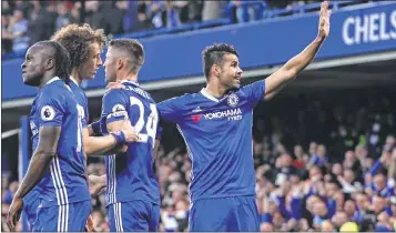  ?? AFP ?? Chelsea's Brazilian-born Spanish striker Diego Costa (R) celebrates after scoring during the English Premier League football match between Chelsea and Middlesbro­ugh at Stamford Bridge in London Monday