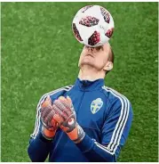  ?? — AFP ?? Eyes on the ball: Sweden goalkeeper Robin Olsen during training ahead of their last 16 match against Switzerlan­d today.