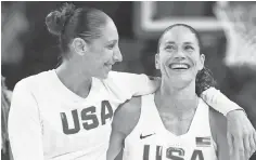  ?? BOB ROSATO, USA TODAY SPORTS ?? “It’s been amazing what we’ve done,” said Diana Taurasi, left, celebratin­g the USA’s gold medal win with teammate Sue Bird.