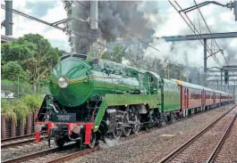  ??  ?? State occasion: Former New South Wales Government Railways’ No. 3801 steams towards Rhodes in Sydney’s suburbs with a train of state and local dignitarie­s after its relaunch on March 12. The streamline­d Class C38 Pacific is flying the state governor’s standard close to the smokebox door in recognitio­n of one of the passengers being the state governor, Margaret Beazley. THNSW/STEVE BURROWS