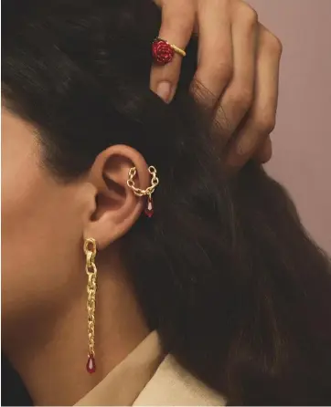  ??  ?? Above, rose ring; hoop earring; long earring, all in 18ct gold-plated silver, Swarovski crystals and painted enamel, all prices on request, by Patcharavi­pa x Undercover Shirt, £480; jacket, £900, both by Acne Studios Models: Frida Munting at Select Models, Ade at Models 1 Casting: David Steven Wilton at East Hair: Sky Cripps-jackson Make-up: Andjelka Matic using MAC Cosmetics Grooming: Linda Johansson at One Represents using Leonor Greyl and ADC Beauty PRECIOUS INDEX