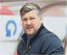  ??  ?? Oxford boss Karl Robinson was shown a red card.