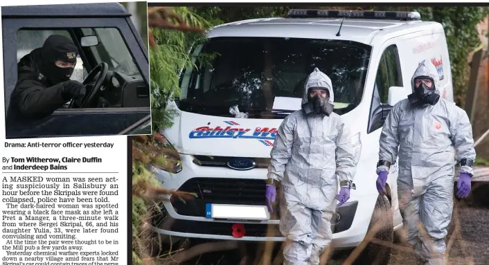  ??  ?? Drama: Anti-terror officer yesterday Sealed off: Specialist­s in breathing apparatus in West Winterslow yesterday with the recovery vehicle