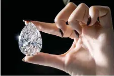  ?? — AFP photo ?? Geneva shows ‘The Rock’, a 228,31 carats pear-shaped white diamond (estimate: US$20,000,000-30,000,000) mined and polished in South Africa over two decades ago, which is the largest white diamond ever to appear for sale at auction, according to Christie’s auction house.