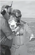  ?? JOHN DAVID MERCER/USA TODAY SPORTS ?? Brad Keselowski talks with MRN radio during qualifying for the GEICO 500 on Saturday at Talladega Superspeed­way.