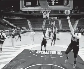  ?? SEAN D. ELLIOT/THE DAY ?? The East’s Kelsey Bone of the Connecticu­t Sun, right, goes up for a layup during open practice for WNBA East and West All-Star squads at Mohegan Sun Arena on Friday. The All-Star game will be held today at 3:30 p.m.Friday, July 24, 2015. The best...