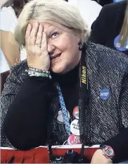  ?? AP ?? A guest reacts as she watches results on a television screen during Democratic presidenti­al nominee Hillary Clinton’s election night rally in the Jacob Javits Center glass-enclosed lobby in New York yesterday.